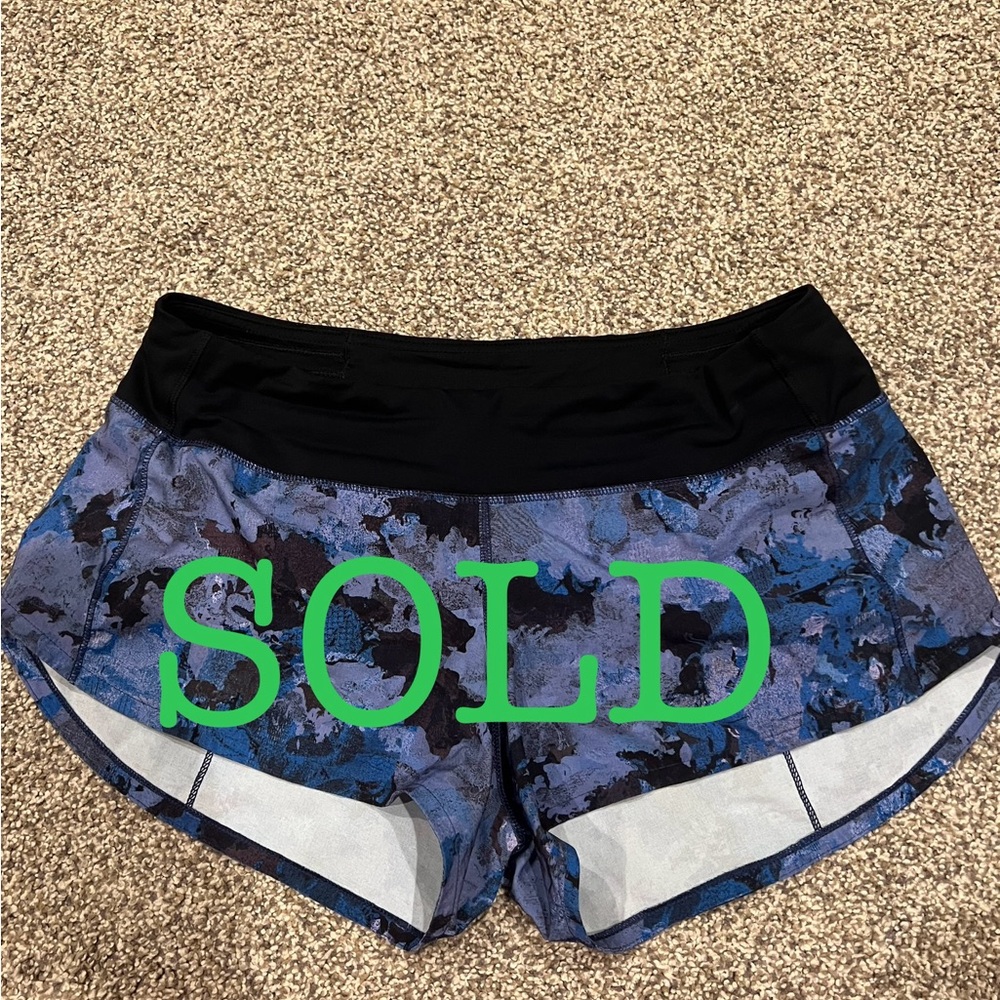 Lululemon Speed Shorts in purple/blue/black print, low rise